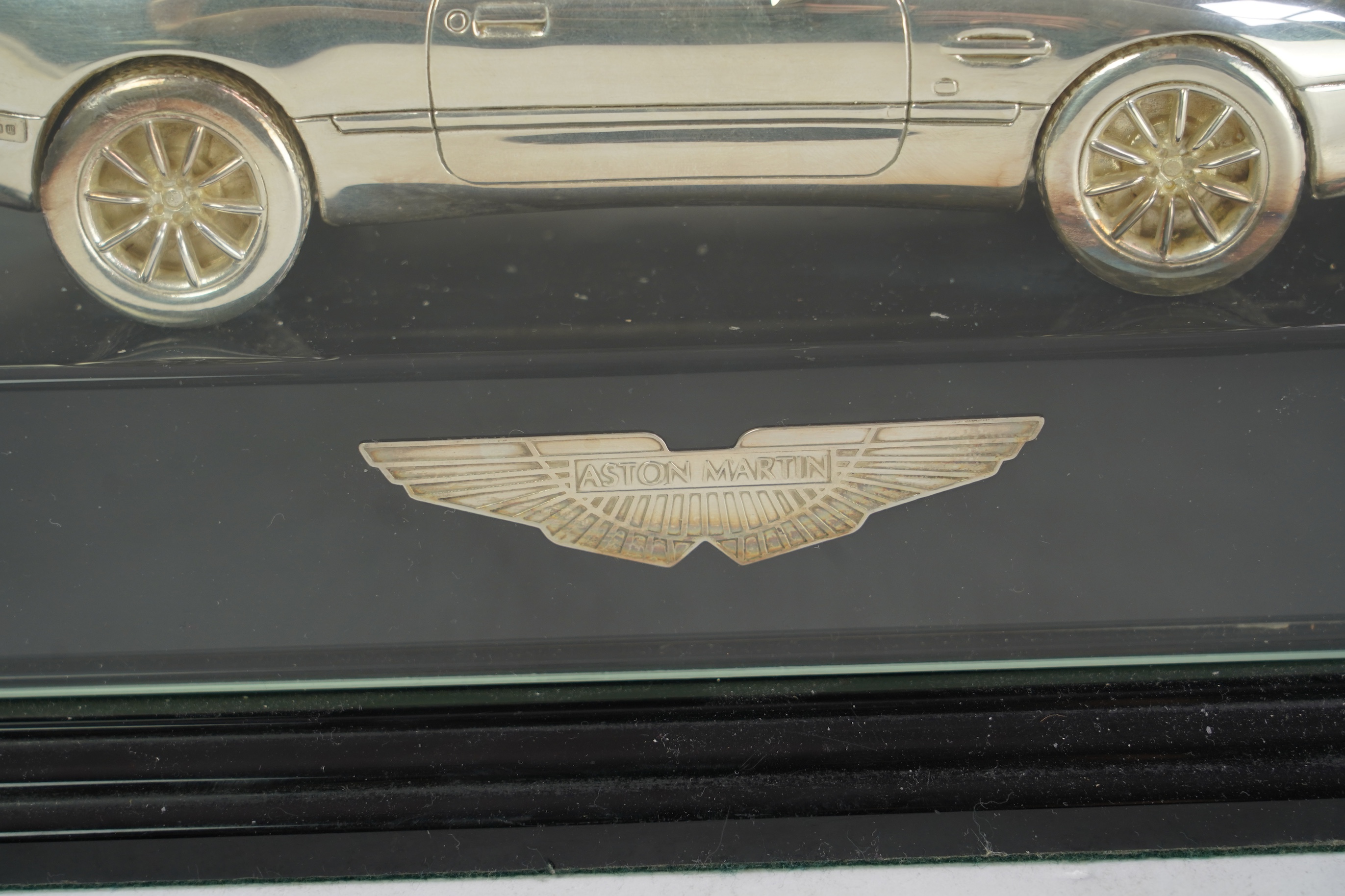 An Elizabeth II miniature silver model of an Aston Martin DB7 Vantage, by Aston Martin Lagonda Design Ltd